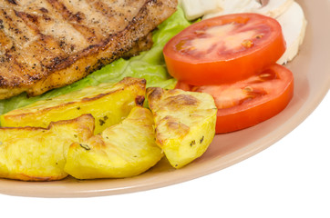 Grilled meat dish on white