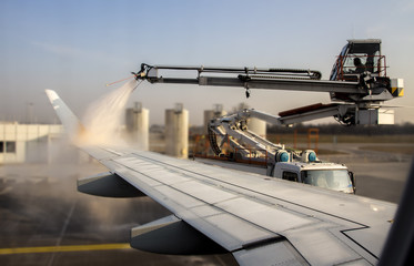 De-icing of an airplane at Munich Airport, Germany, 2015