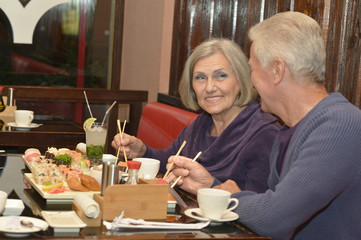 Elderly couple eating 