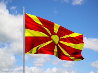 Macedonia 3d flag floating in the wind in blue sky