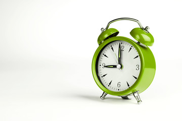 Nine o'clock. Green classic clock on white background.