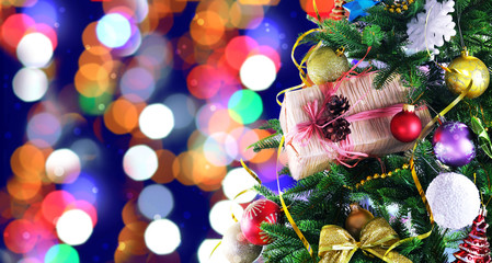 Decorated Christmas tree on festive shiny background