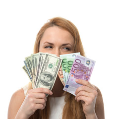 Happy young woman holding up cash money compare euro dollars