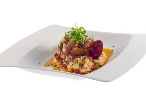 fried rabbit with spicy red sauce, risotto & chorizo