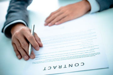 Business man signing a contract