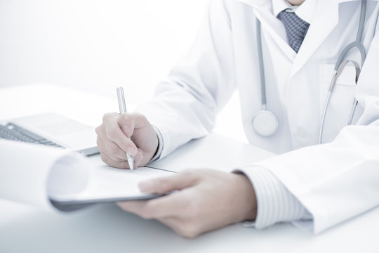 Close-up of a medical worker with laptop