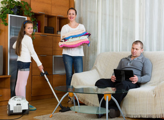 Daughter helping mother to clean