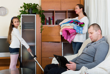 Daughter helping mother to clean