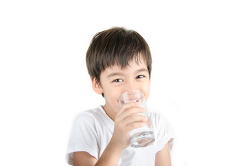 little asian boy drinks water from a glass