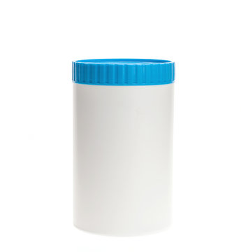 White plastic medicine bottle with blue cap