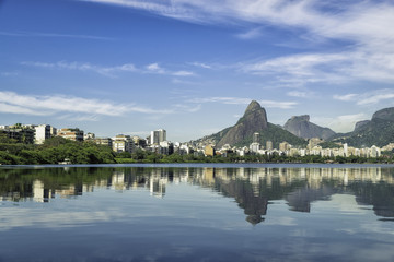 Fototapeta na wymiar Sunrise over mountains in Rio de Janeiro with water reflection