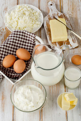 Milk products on  white wooden table.