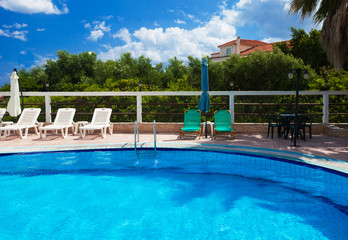 Fototapeta na wymiar Swimming pool with stair at hotel
