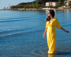 Woman with long yellow dress