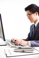 Handsome businessman working with laptop