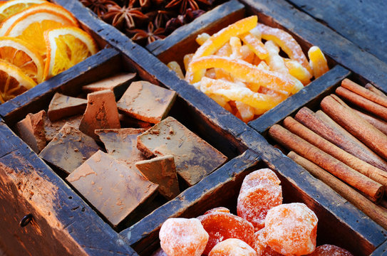 Dark Chocolate, Kumquats, Cinnamon And Dry Fruits In Wooden Box