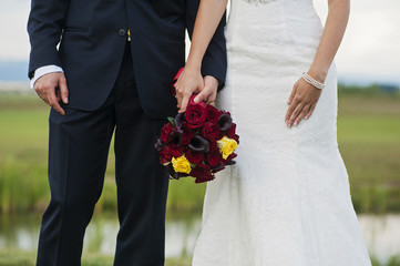 Bride and groom with wedding bouquet
