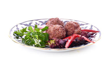 Meat on a grill with vegetables