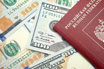 Fototapeta premium Russian passport with American dollars