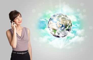 Young woman with earth and cloud concept
