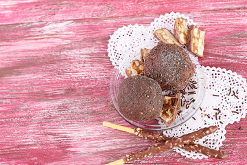 Cupcake with chocolate on wooden background