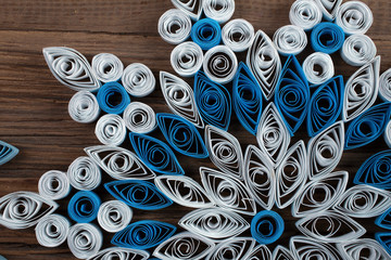 snowflake out of paper quilling - 81093059