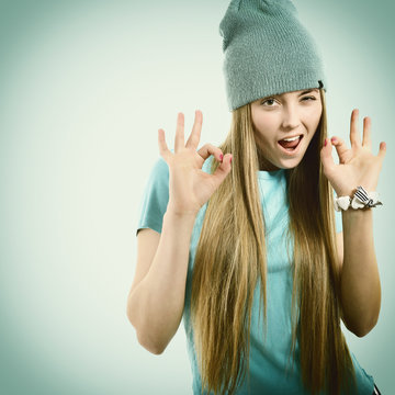 Beautiful joyful girl hipster looking at camera, happy smiling a