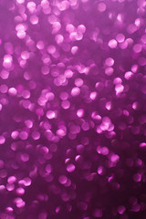 Violet glittering lights. Blurred abstract background