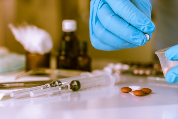 Drugs in a measuring cylinder