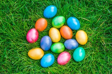 Fototapeta na wymiar Colorful Easter eggs on a green grass