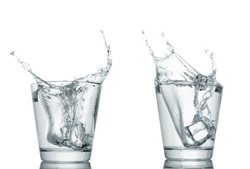 water splash in glasses isolated on white