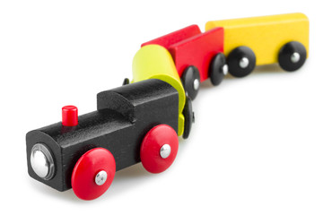 Fototapeta premium Colorful wooden toy train isolated over white background