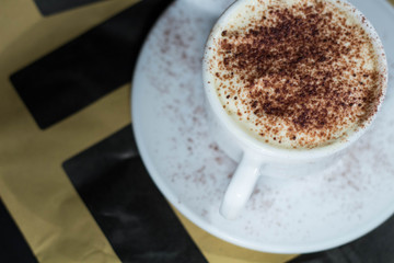 A cappuccino cup with cacao