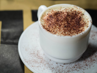 A cappuccino cup with cacao