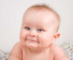 Infant European boy with big blue eyes portrait