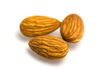 Group of Almond nuts isolated on white background