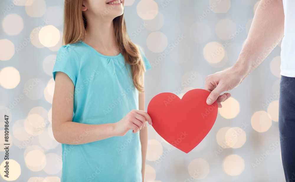 Poster close up of girl and male hand holding red heart