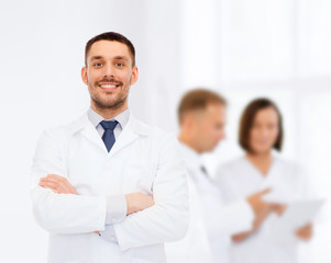 Fototapeta na wymiar smiling male doctor in white coat