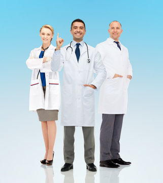 Group Of Smiling Doctors In White Coats