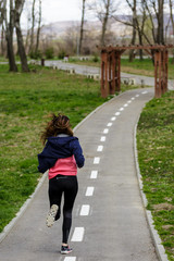 sporty woman running in the park