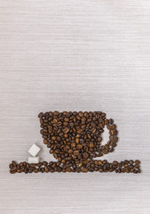 Coffee beans in a cup and sugar