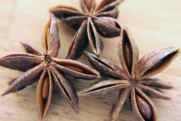 Stars anise on wood background