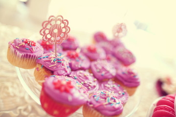 Delicious cupcakes on table