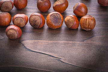 set of hazelnuts on vintage wooden board food and drink concept