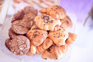 Cookies and croissants on plate