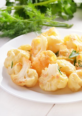 Baked cauliflower on white plate