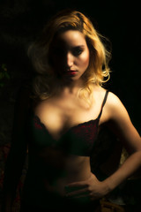 Sultry Portrait of Sexy Blonde Woman in Dark Mood Lighting