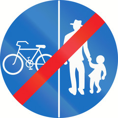 Austrian traffic sign at the end of a shared-use path with separate lanes, left lane for bicycles and right lane for pedestrians