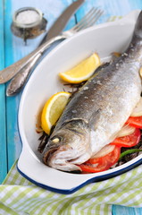 baked fish with herbs, vegetables and garlic