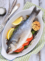 baked fish with herbs, vegetables and garlic